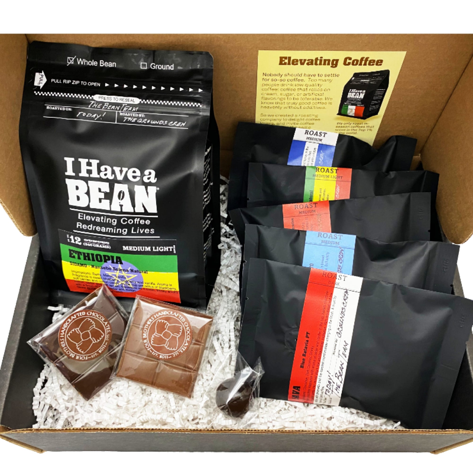 Inside of the Brew Masters Gift Box with coffee samples and chocolate