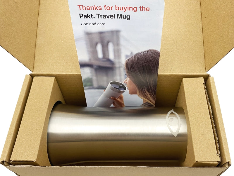 Side view of the Pakt tumbler inside a box emphasizing its ergonomic design and smooth finish