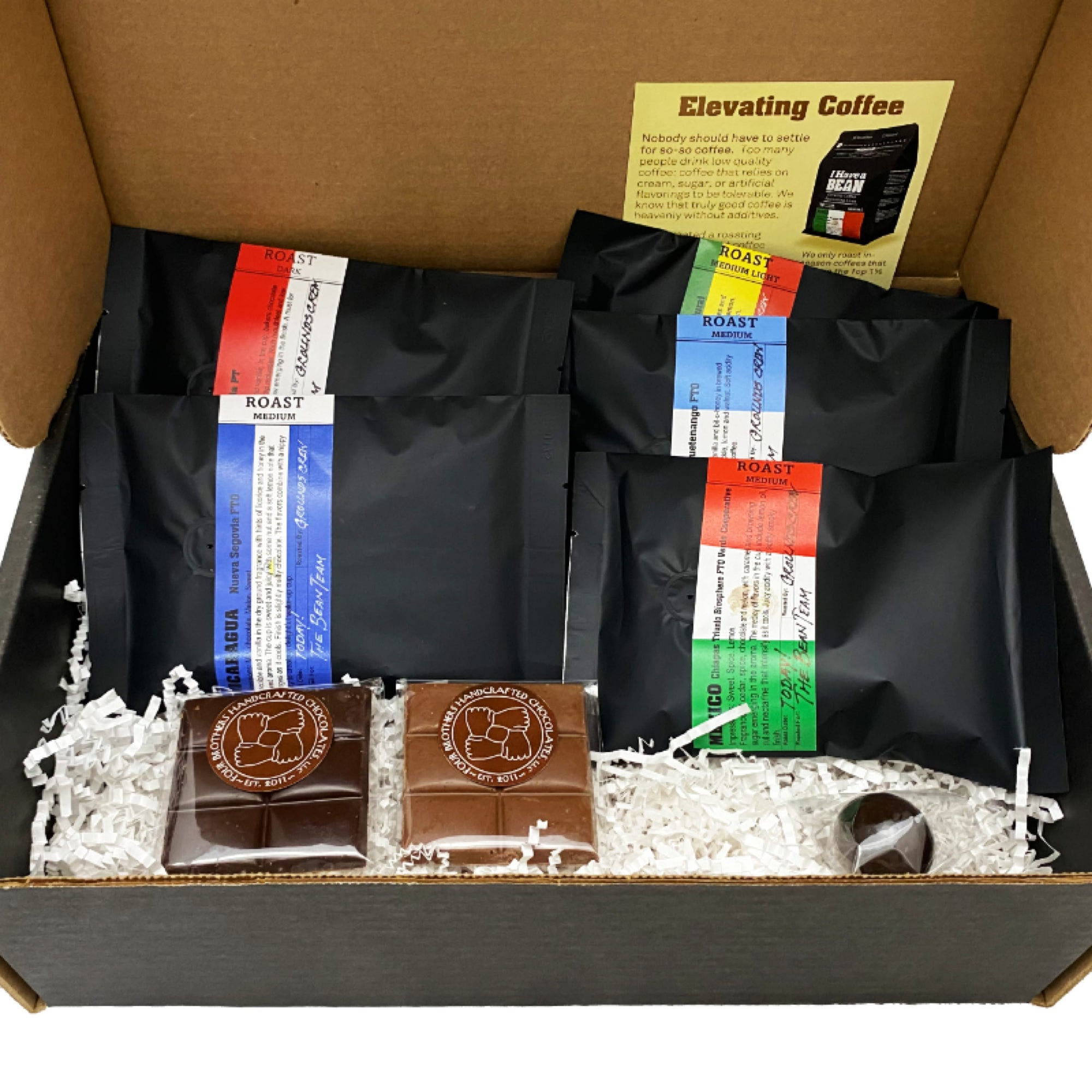 Inside of the Q-Graders Gift Box with coffee samples and chocolate