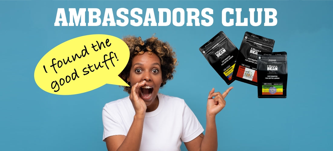 Young Black woman pointing to three I Have a Bean coffee bags while cupping her other hand to her mouth; a speech bubble says 'I found the good stuff'