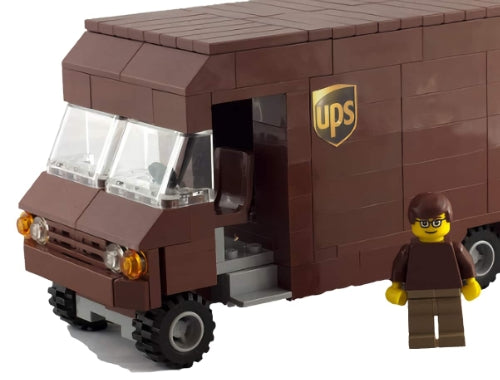 Custom brown LEGO UPS truck with a matching LEGO delivery figurine in brown clothes and glasses standing beside it